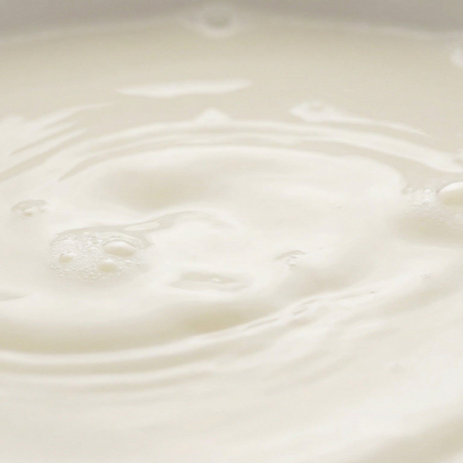 Close-up of creamy white milk with ripples