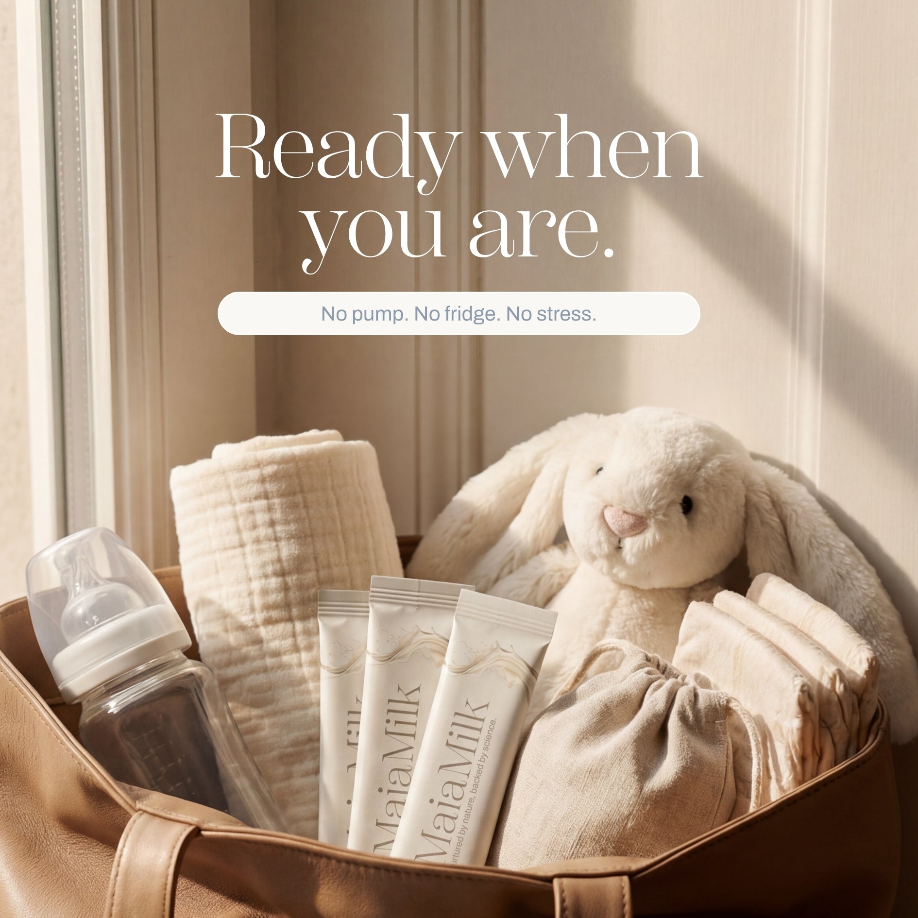 Baby care items including a box of MaiaMilk, a bottle, wipes, and a plush toy in a bag with text 'Ready when you are.'